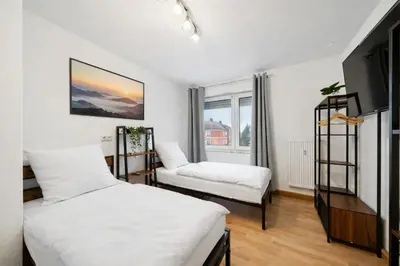 Ein Bett oder Betten in einem Zimmer der Unterkunft Geräumige Wohnung, 3 Schlafzimmer, Küche, Bad
