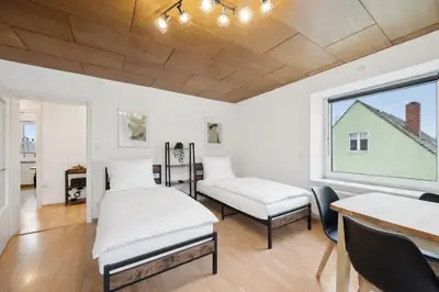 Ein Bett oder Betten in einem Zimmer der Unterkunft Geräumige Wohnung, 3 Schlafzimmer, Küche, Bad