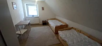 Ein Bett oder Betten in einem Zimmer der Unterkunft Haus am Park