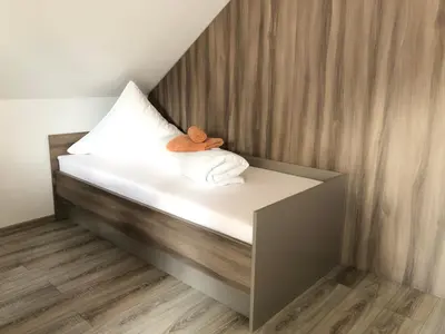 Ein Bett oder Betten in einem Zimmer der Unterkunft Hotel Goldenesvogtland