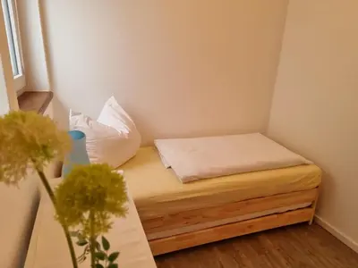 Ein Bett oder Betten in einem Zimmer der Unterkunft Between city and nature