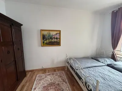 Ein Bett oder Betten in einem Zimmer der Unterkunft Maxplatz