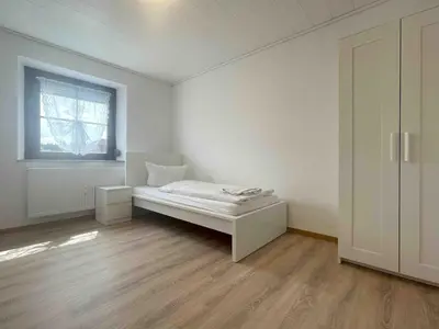 Ein Bett oder Betten in einem Zimmer der Unterkunft WEN111 große Monteurwohnung