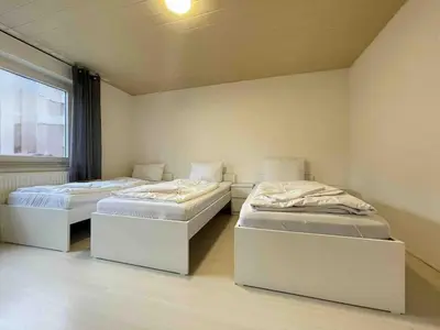 Ein Bett oder Betten in einem Zimmer der Unterkunft SAD155 moderne Monteurwohnung