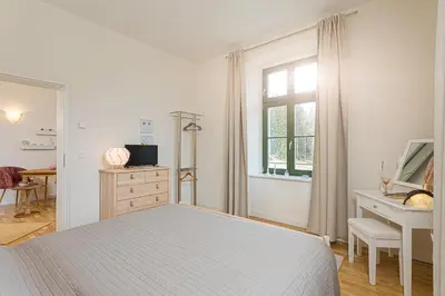 Ein Bett oder Betten in einem Zimmer der Unterkunft Alte Försterei Wildenthal am Kammweg Erzgebirge Ferienwohnung 1