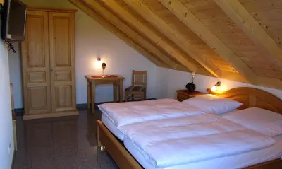 Ein Bett oder Betten in einem Zimmer der Unterkunft Gasthof - Pension SPARRER-WIRT