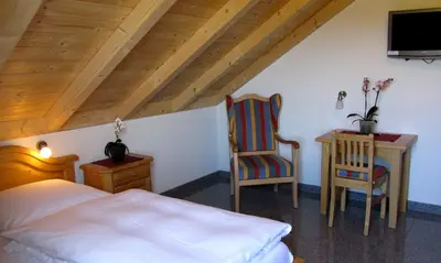 Ein Bett oder Betten in einem Zimmer der Unterkunft Gasthof - Pension SPARRER-WIRT
