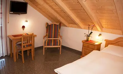 Ein Bett oder Betten in einem Zimmer der Unterkunft Gasthof - Pension SPARRER-WIRT