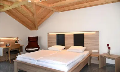 Ein Bett oder Betten in einem Zimmer der Unterkunft Gasthof - Pension SPARRER-WIRT