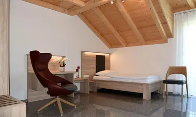 Ein Bett oder Betten in einem Zimmer der Unterkunft Gasthof - Pension SPARRER-WIRT