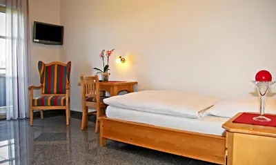Ein Bett oder Betten in einem Zimmer der Unterkunft Gasthof - Pension SPARRER-WIRT