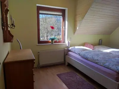 Ein Bett oder Betten in einem Zimmer der Unterkunft Ferienwohnung mit Herz Zierold