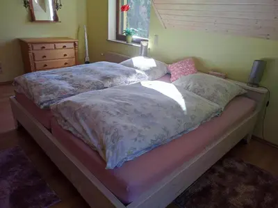 Ein Bett oder Betten in einem Zimmer der Unterkunft Ferienwohnung mit Herz Zierold