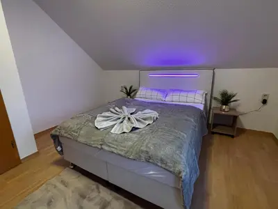Ein Bett oder Betten in einem Zimmer der Unterkunft Macabu Luxus Villa Plauen