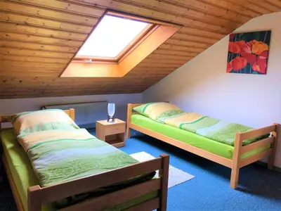 Ein Bett oder Betten in einem Zimmer der Unterkunft Haus Evi