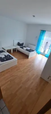 Ein Bett oder Betten in einem Zimmer der Unterkunft Ferien Haus in Wackersdorf ID WA101