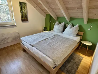 Ein Bett oder Betten in einem Zimmer der Unterkunft Brückelsee-Chalet