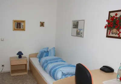 Ein Bett oder Betten in einem Zimmer der Unterkunft Hotel Bayerischer Hof