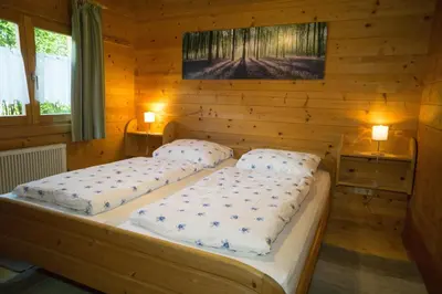 Ein Bett oder Betten in einem Zimmer der Unterkunft Blockhaus Bayerischer Wald Chalet 2
