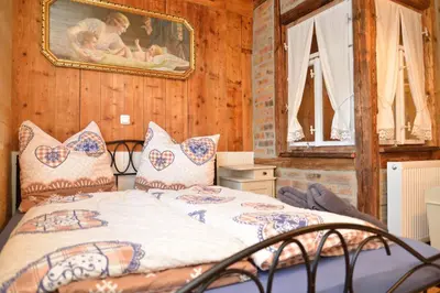 Ein Bett oder Betten in einem Zimmer der Unterkunft Fw. Glashütte Anno Dazumal