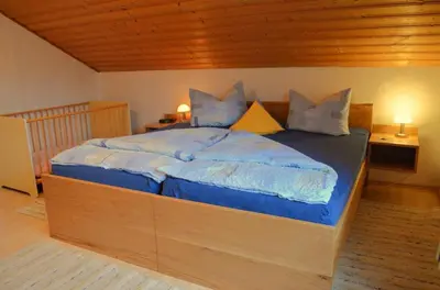 Ein Bett oder Betten in einem Zimmer der Unterkunft Bio-Erlebnisbauernhof Doll