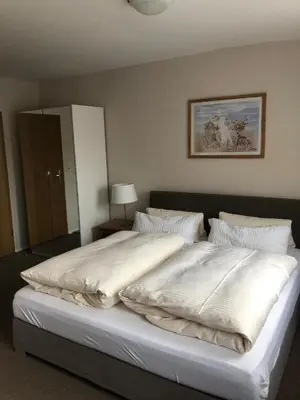 Ein Bett oder Betten in einem Zimmer der Unterkunft Pension Stauber
