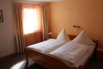 Ein Bett oder Betten in einem Zimmer der Unterkunft Pension Stauber