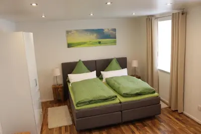 Ein Bett oder Betten in einem Zimmer der Unterkunft Pension Stauber