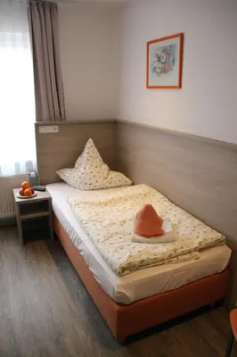 Ein Bett oder Betten in einem Zimmer der Unterkunft Rathausstuben