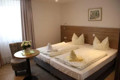 Ein Bett oder Betten in einem Zimmer der Unterkunft Rathausstuben