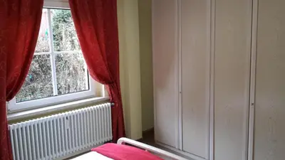 Ein Bett oder Betten in einem Zimmer der Unterkunft Ferienwohnungen Villa Goldbrunnen