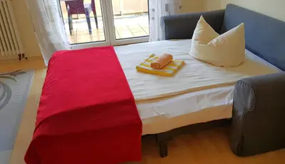 Ein Bett oder Betten in einem Zimmer der Unterkunft Ferienwohnungen Villa Goldbrunnen
