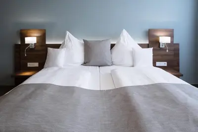 Ein Bett oder Betten in einem Zimmer der Unterkunft Apart-Hotel FirstBoarding Bayreuth