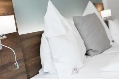 Ein Bett oder Betten in einem Zimmer der Unterkunft Apart-Hotel FirstBoarding Bayreuth