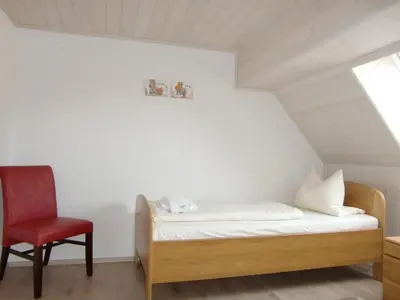 Ein Bett oder Betten in einem Zimmer der Unterkunft Landhotel Fuchsbau