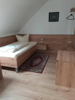 Ein Bett oder Betten in einem Zimmer der Unterkunft Landhotel Fuchsbau