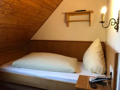Ein Bett oder Betten in einem Zimmer der Unterkunft Hotel Wurzer
