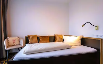 Ein Bett oder Betten in einem Zimmer der Unterkunft Hotel Wurzer