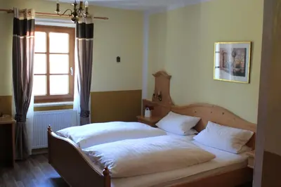 Ein Bett oder Betten in einem Zimmer der Unterkunft Landhotel Kahrmühle