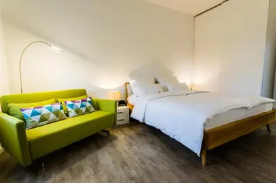 Ein Bett oder Betten in einem Zimmer der Unterkunft Apartmenthaus Königsallee