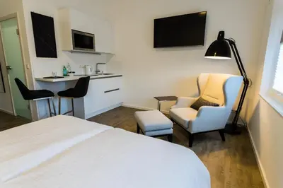 Ein Bett oder Betten in einem Zimmer der Unterkunft Apartmenthaus Königsallee