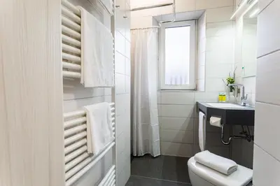 Ein Badezimmer in der Unterkunft Apartmenthaus Königsallee