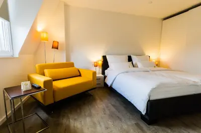 Ein Bett oder Betten in einem Zimmer der Unterkunft Apartmenthaus Königsallee