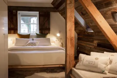 Ein Bett oder Betten in einem Zimmer der Unterkunft Posthotel Alexander Herrmann