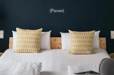 Ein Bett oder Betten in einem Zimmer der Unterkunft Posthotel Alexander Herrmann