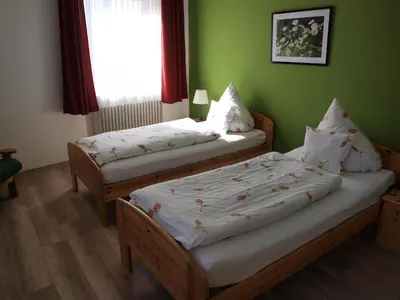 Ein Bett oder Betten in einem Zimmer der Unterkunft Landgasthof Zum goldenen Löwen
