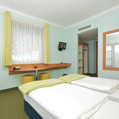 Ein Bett oder Betten in einem Zimmer der Unterkunft Hotel Fränkische Schweiz-Pegnitz