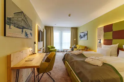 Ein Bett oder Betten in einem Zimmer der Unterkunft Rathaushotels All Inklusive