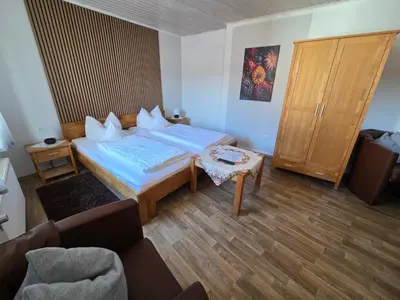Ein Bett oder Betten in einem Zimmer der Unterkunft Pension Gisela