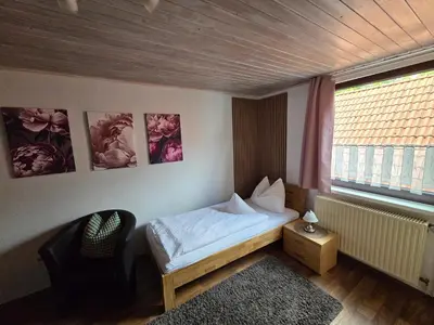 Ein Bett oder Betten in einem Zimmer der Unterkunft Pension Gisela